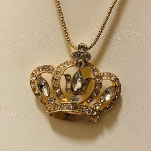 Gorgeous gold tone crown pendants and necklaces.
